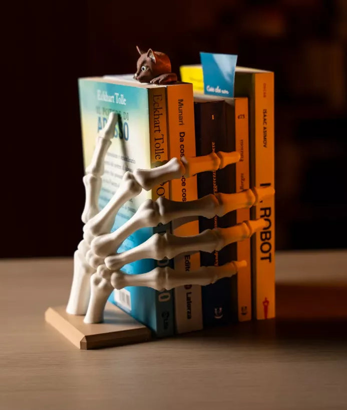 Manitos Blancas, Sujetador de libros.